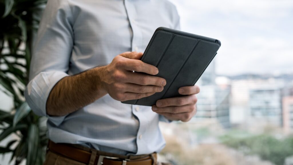 Real estate professional reviewing Facebook and Google Ads performance metrics