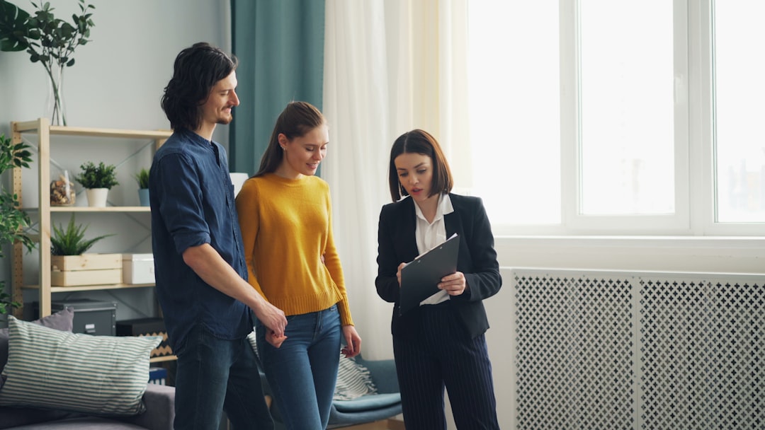 Real estate professional explaining digital marketing analytics to a home seller