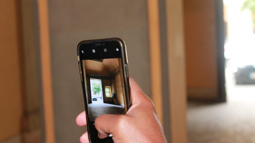Real estate agent filming an authentic, unpolished home tour on a smartphone for TikTok